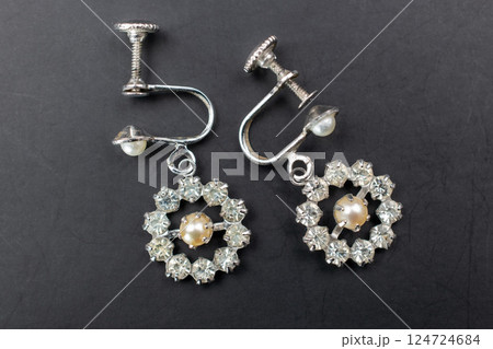 Unique earrings for women on a black background, promotional photo for an online vintage and handmade jewelry store 124724684