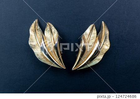 Unique earrings for women on a black background, promotional photo for an online vintage and handmade jewelry store 124724686