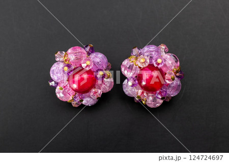 Unique earrings for women on a black background, promotional photo for an online vintage and handmade jewelry store 124724697