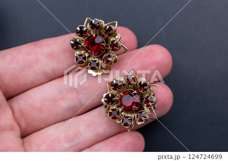 Unique earrings for women on a black background, promotional photo for an online vintage and handmade jewelry store Unique earrings for women on a black background, promotional photo for an online vintage and handmade jewelry store 124724699
