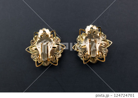 Unique earrings for women on a black background, promotional photo for an online vintage and handmade jewelry store Unique earrings for women on a black background, promotional photo for an online vintage and handmade jewelry store 124724701