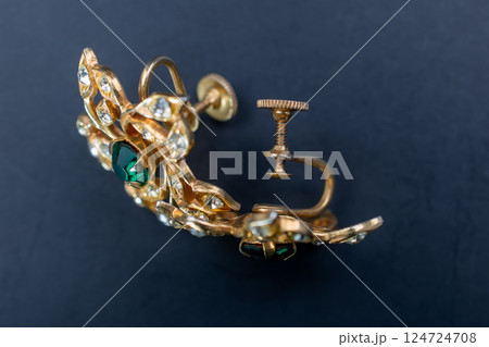 Unique earrings for women on a black background, promotional photo for an online vintage and handmade jewelry store 124724708