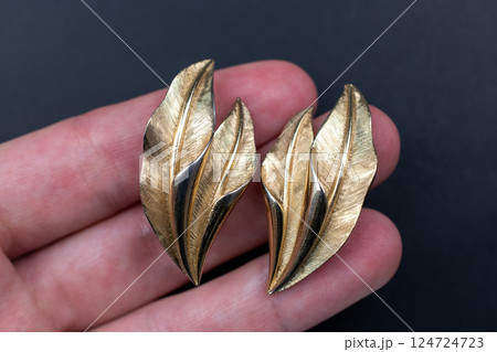 Unique earrings for women on a black background, promotional photo for an online vintage and handmade jewelry store Unique earrings for women on a black background, promotional photo for an online vintage and handmade jewelry store 124724723