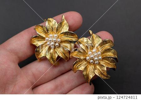 Unique earrings for women on a black background, promotional photo for an online vintage and handmade jewelry store 124724811