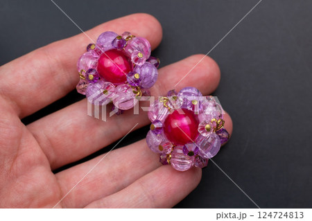 Unique earrings for women on a black background, promotional photo for an online vintage and handmade jewelry store 124724813