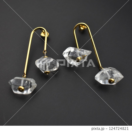 Unique earrings for women on a black background, promotional photo for an online vintage and handmade jewelry store 124724821