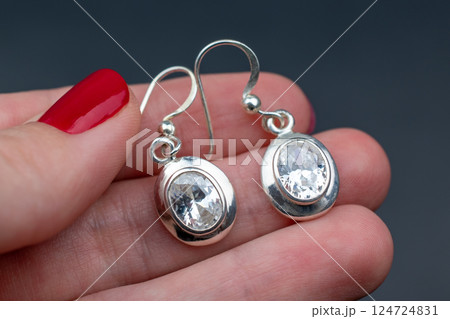 Unique earrings for women on a black background, promotional photo for an online vintage and handmade jewelry store 124724831