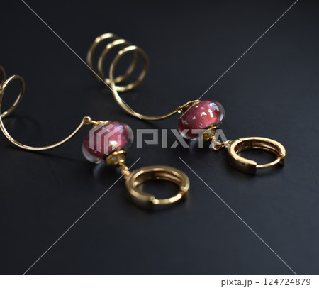 Unique earrings for women on a black background, promotional photo for an online vintage and handmade jewelry store Unique earrings for women on a black background, promotional photo for an online vintage and handmade jewelry store 124724879