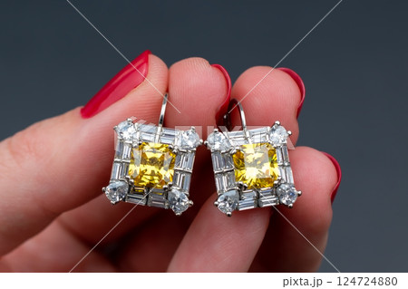 Unique earrings for women on a black background, promotional photo for an online vintage and handmade jewelry store Unique earrings for women on a black background, promotional photo for an online vintage and handmade jewelry store 124724880