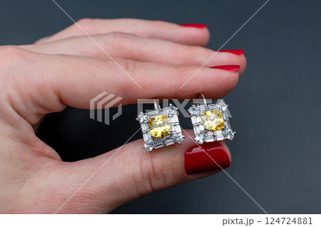 Unique earrings for women on a black background, promotional photo for an online vintage and handmade jewelry store Unique earrings for women on a black background, promotional photo for an online vintage and handmade jewelry store 124724881
