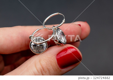 Unique earrings for women on a black background, promotional photo for an online vintage and handmade jewelry store 124724882