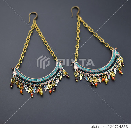 Unique earrings for women on a black background, promotional photo for an online vintage and handmade jewelry store 124724888