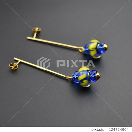 Unique earrings for women on a black background, promotional photo for an online vintage and handmade jewelry store Unique earrings for women on a black background, promotional photo for an online vintage and handmade jewelry store 124724904