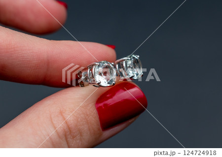 Unique earrings for women on a black background, promotional photo for an online vintage and handmade jewelry store 124724918