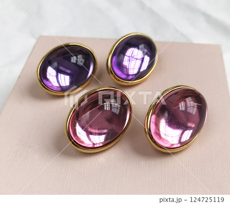 Unique earrings for women on a pink background, promotional photo for an online vintage and handmade jewelry store Unique earrings for women on a pink background, promotional photo for an online vintage and handmade jewelry store 124725119