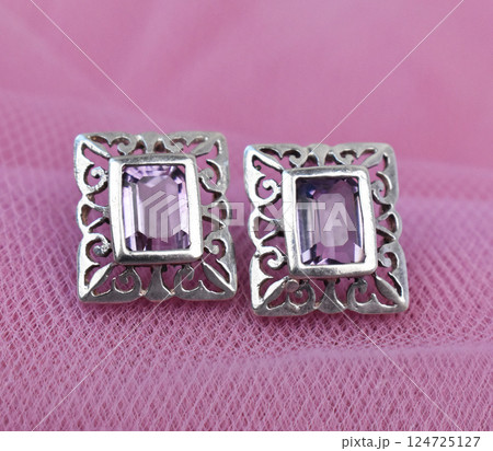 Unique earrings for women on a pink background, promotional photo for an online vintage and handmade jewelry store Unique earrings for women on a pink background, promotional photo for an online vintage and handmade jewelry store 124725127