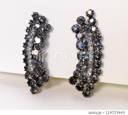 Unique earrings for women on a white background, promotional photo for an online vintage and handmade jewelry store 124725443
