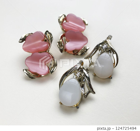 Unique earrings for women on a white background, promotional photo for an online vintage and handmade jewelry store 124725494