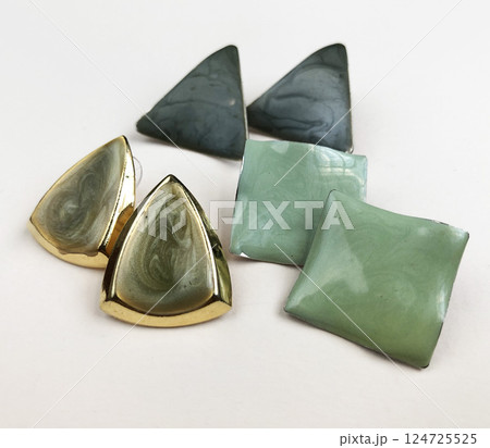 Unique earrings for women on a white background, promotional photo for an online vintage and handmade jewelry store Unique earrings for women on a white background, promotional photo for an online vintage and handmade jewelry store 124725525