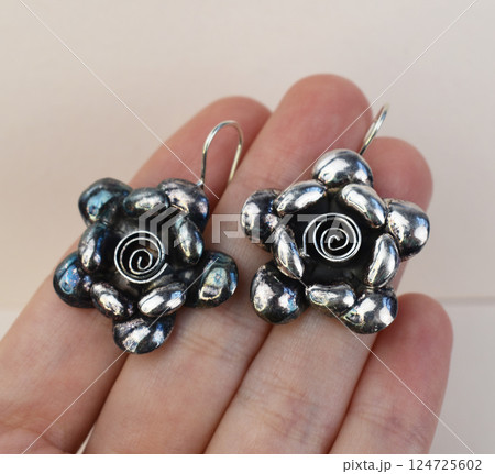 Unique earrings for women on a white background, promotional photo for an online vintage and handmade jewelry store 124725602
