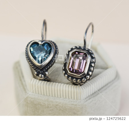 Unique earrings for women on a white background, promotional photo for an online vintage and handmade jewelry store Unique earrings for women on a white background, promotional photo for an online vintage and handmade jewelry store 124725622