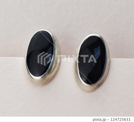 Unique earrings for women on a white background, promotional photo for an online vintage and handmade jewelry store Unique earrings for women on a white background, promotional photo for an online vintage and handmade jewelry store 124725631