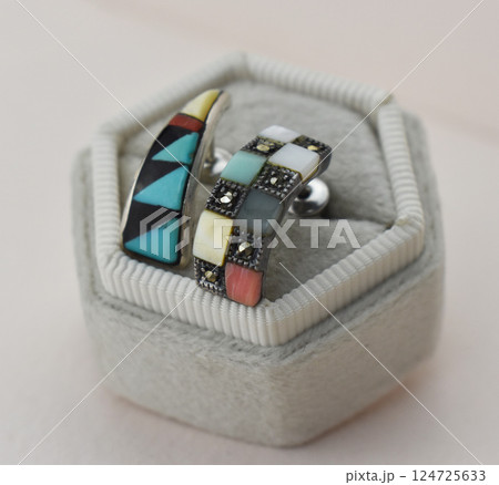 Unique earrings for women on a white background, promotional photo for an online vintage and handmade jewelry store 124725633