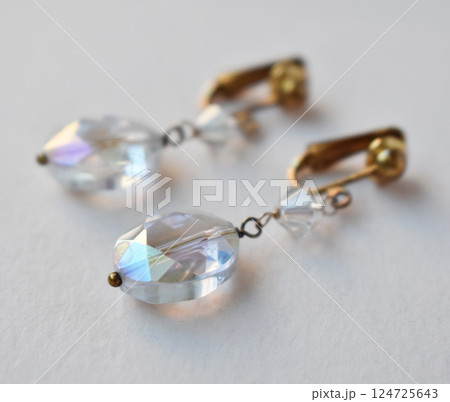 Unique earrings for women on a white background, promotional photo for an online vintage and handmade jewelry store 124725643