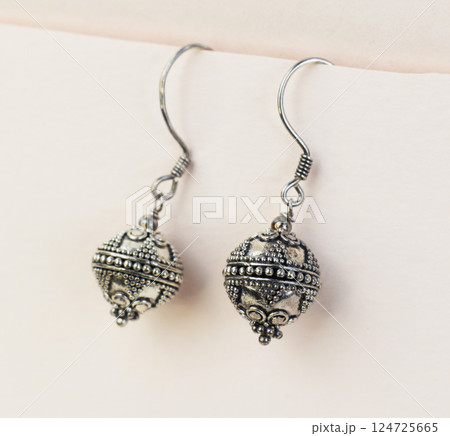 Unique earrings for women on a white background, promotional photo for an online vintage and handmade jewelry store 124725665