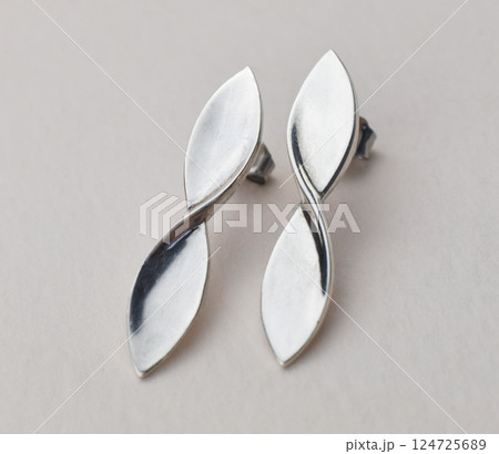 Unique earrings for women on a white background, promotional photo for an online vintage and handmade jewelry store 124725689