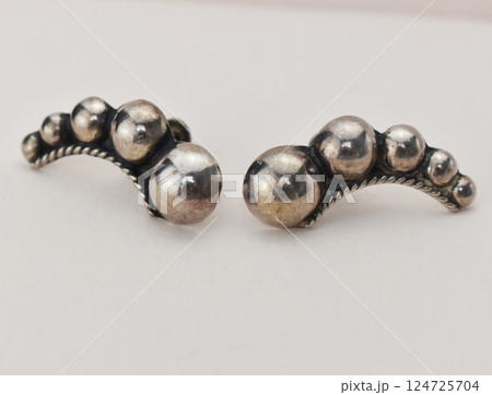 Unique earrings for women on a white background, promotional photo for an online vintage and handmade jewelry store 124725704