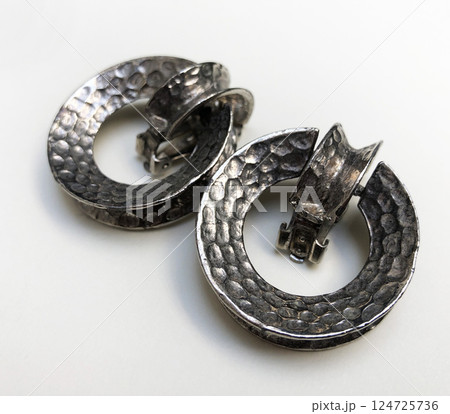Unique earrings for women on a white background, promotional photo for an online vintage and handmade jewelry store Unique earrings for women on a white background, promotional photo for an online vintage and handmade jewelry store 124725736