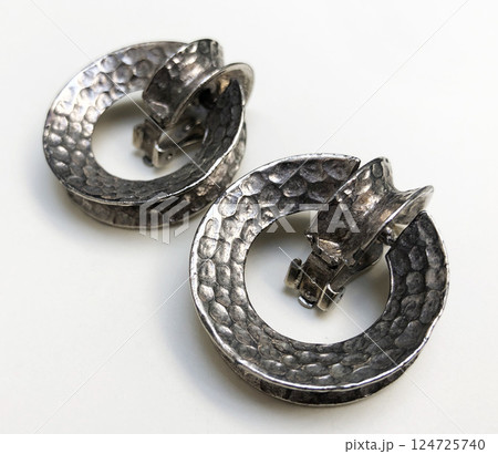 Unique earrings for women on a white background, promotional photo for an online vintage and handmade jewelry store Unique earrings for women on a white background, promotional photo for an online vintage and handmade jewelry store 124725740