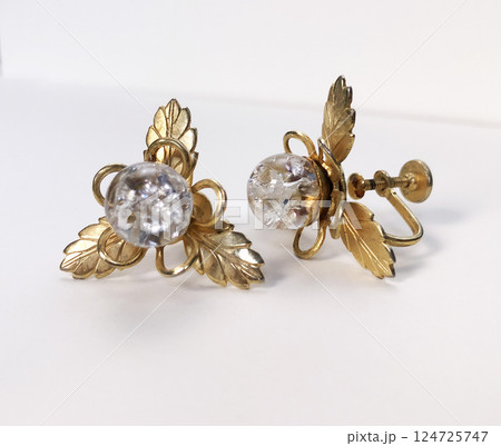 Unique earrings for women on a white background, promotional photo for an online vintage and handmade jewelry store Unique earrings for women on a white background, promotional photo for an online vintage and handmade jewelry store 124725747