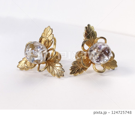 Unique earrings for women on a white background, promotional photo for an online vintage and handmade jewelry store Unique earrings for women on a white background, promotional photo for an online vintage and handmade jewelry store 124725748