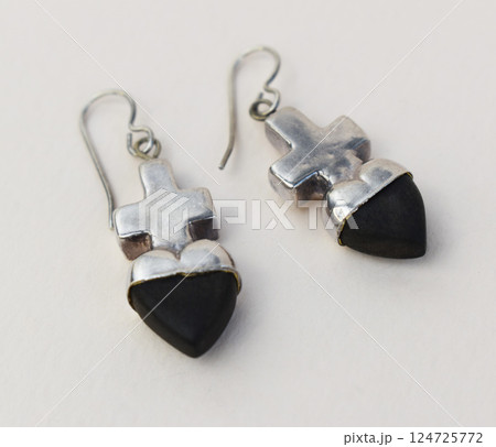 Unique earrings for women on a white background, promotional photo for an online vintage and handmade jewelry store Unique earrings for women on a white background, promotional photo for an online vintage and handmade jewelry store 124725772