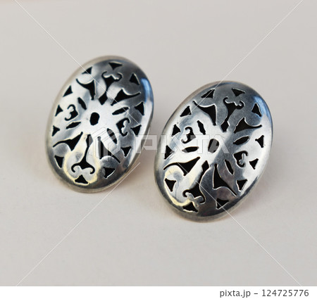 Unique earrings for women on a white background, promotional photo for an online vintage and handmade jewelry store Unique earrings for women on a white background, promotional photo for an online vintage and handmade jewelry store 124725776