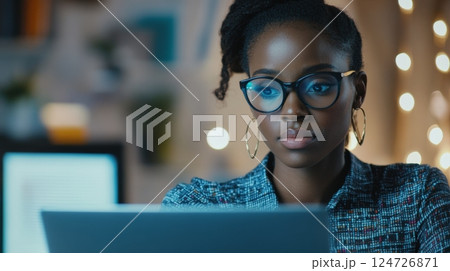 Focused businesswoman analyzing financial data 124726871