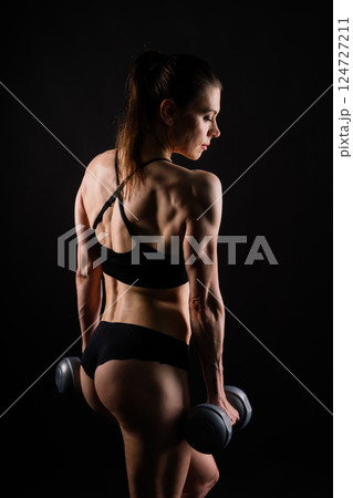 Happy woman do exercise with dumbbell. Smiling female, fitness workout. Healthy lifestyle concept. 124727211