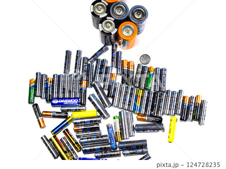 Salt and alkaline batteries, a source of energy for portable technology. AAA and AA batteries 124728235