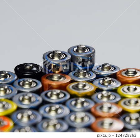 Salt and alkaline batteries, source of energy for portable technology. AAA and AA batteries Salt and alkaline batteries, source of energy for portable technology. AAA and AA batteries 124728262
