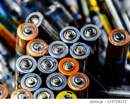 Salt and alkaline batteries, source of energy for portable technology. AAA and AA batteries 124728272