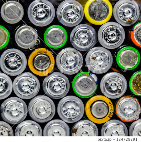 Salt and alkaline batteries, source of energy for portable technology. AAA and AA batteries 124728291