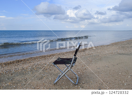 Folding chair by the sea. Convenience to the tourist. Rest by the sea. 124728332