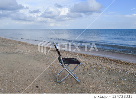 Folding chair by the sea. Convenience to the tourist. Rest by the sea. 124728333