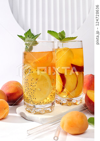 Diet vegan cocktail with chia seeds, lime, lemon, mint and apricots. Detox diet and weight loss concept, summer party and healthy lifestyle advertising. Menu for cafe and restaurant. Diet vegan cocktail with chia seeds, lime, lemon, mint and apricots. Detox diet and weight loss concept, summer party and healthy lifestyle advertising. Menu for cafe and restaurant. 124728636