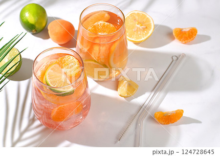 Summer party and healthy lifestyle advertising banner, diet vegan cocktail with chia seeds, lime, lemon, mint and apricots. Detox diet and weight loss concept, Menu for cafe and restaurant. Summer party and healthy lifestyle advertising banner, diet vegan cocktail with chia seeds, lime, lemon, mint and apricots. Detox diet and weight loss concept, Menu for cafe and restaurant. 124728645