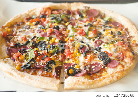 Enjoy a mouthwatering Pepperoni and Veggie Pizza topped with vibrant Colorful Toppings Enjoy a mouthwatering Pepperoni and Veggie Pizza topped with vibrant Colorful Toppings 124729369