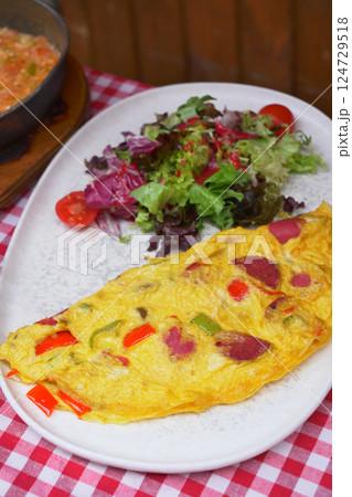 Egg Omelette with sausage on table  124729518