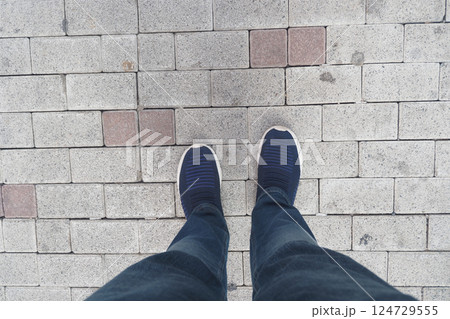 A Beautiful Urban Scene Featuring Casual Footwear on a Paved Walkway, Stylish and Modern 124729555